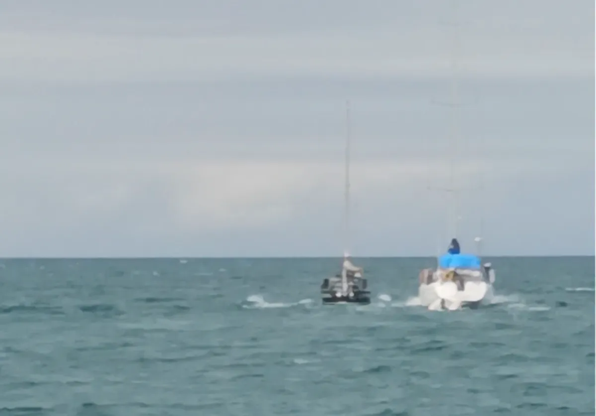 Following us out of the bay